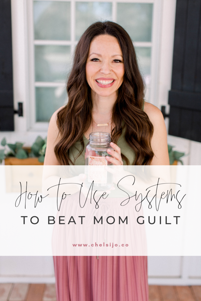 Chelsi Jo stands smiling holding a mason jar, text reads how to use systems to beat mom guilt